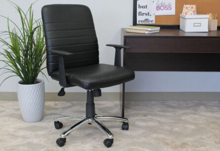 Office space featuring a Retro Task Chair with Black T-Arms, a white potted plant, and a desk with motivational decor and a coffee mug.