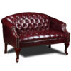 A Classic Traditional Button Tufted Loveseat loveseat with button tufting and ornate wooden legs.