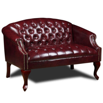 A Classic Traditional Button Tufted Loveseat loveseat with button tufting and ornate wooden legs.