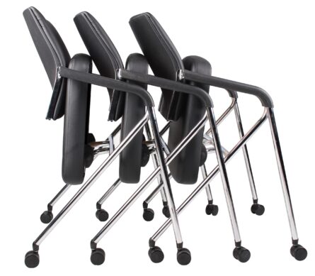 A stack of five folded TOS Black Caressoft Plus Training Chairs with Chrome Frames and Casters.