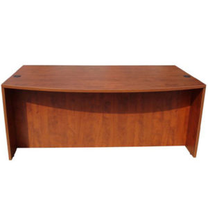 A simple TOS Bow Front Desk Shell in Cherry Laminate with a curved front and flat back, showcasing a smooth finish and natural wood grain.