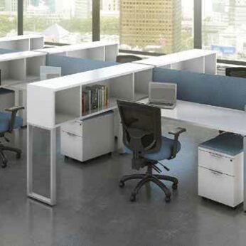 Modern office space with several Elements Series Desks with floor supported Hutch, each featuring a desk, chairs, and shelves, set against large windows overlooking a cityscape.