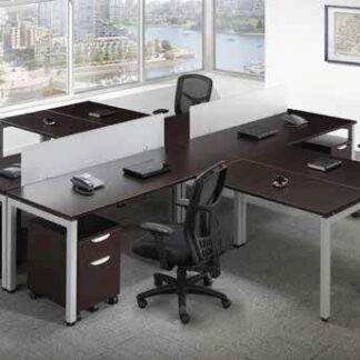 Modern office interior featuring the Elements 4 pack station with computers, chairs, and a view of a cityscape through large windows.