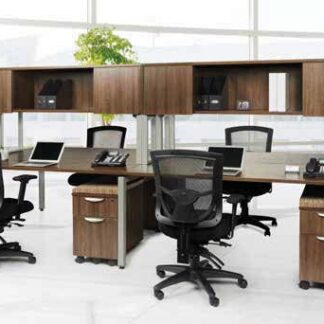 Modern office space featuring a cluster of Elements desks with overhead #3 (Single Unit) in black office chairs, laptops, and partition panels.