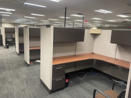 A cubicle with many different colors and some brown