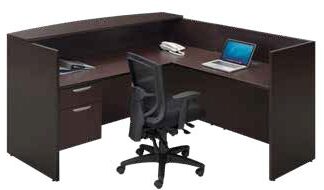 Standard Reception Station with Return with an ergonomic black chair and a laptop, isolated on a white background.