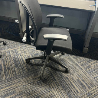 Office chair on carpeted floor.