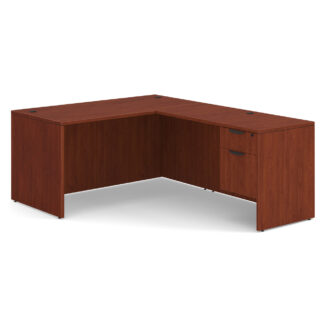 L-shaped wooden desk with drawers.